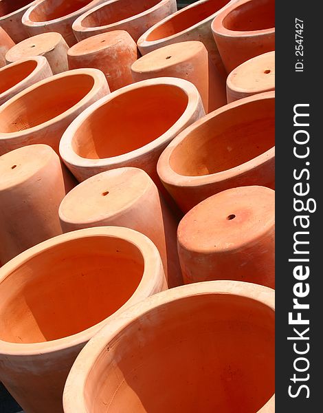 An Arrangement of Terra-cotta Pots Creates an Abstract Design.