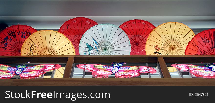 Photo of colorful umbrella inside pavillion