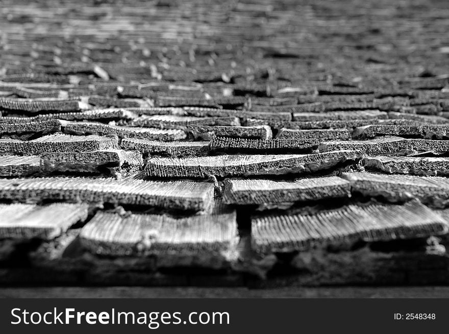 Close up of old, worn shingles lin black and white to complete the mood. Close up of old, worn shingles lin black and white to complete the mood