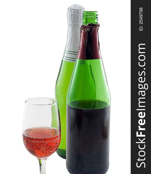 Two bottles of wine and a glass of wine isolated on white