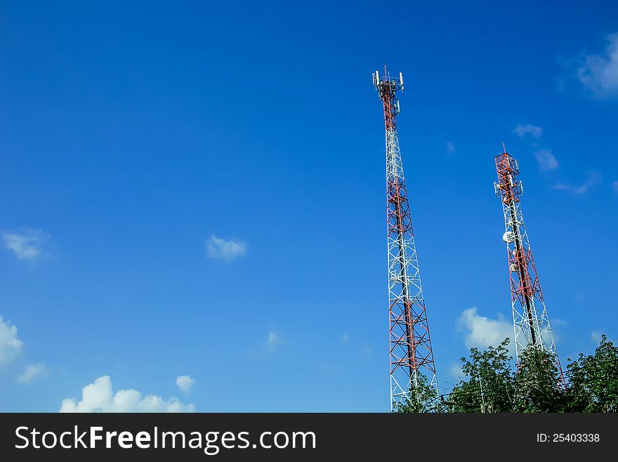 A communications tower on sky blackground