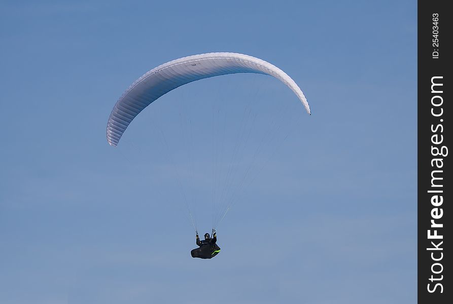 A para-glider against a clear blue sky. A para-glider against a clear blue sky