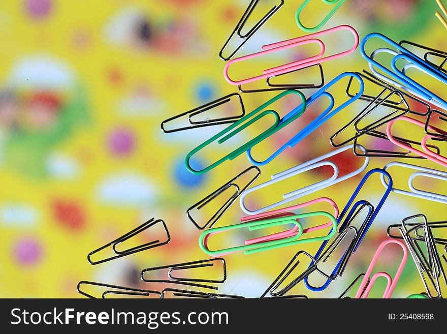 Colorful paper clips on the desk Transparent