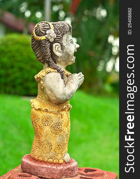 A female stone doll posts in Wei (Thai language = welcome). A female stone doll posts in Wei (Thai language = welcome)