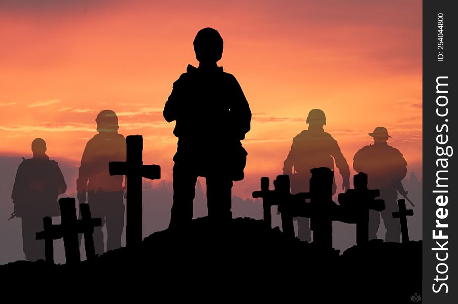 A Soldier In The Dying Day Is Standing On The Grave Of His Dead Friends.