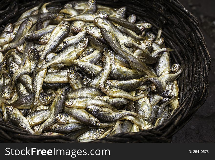 A basket of small fishes for sale. A basket of small fishes for sale.