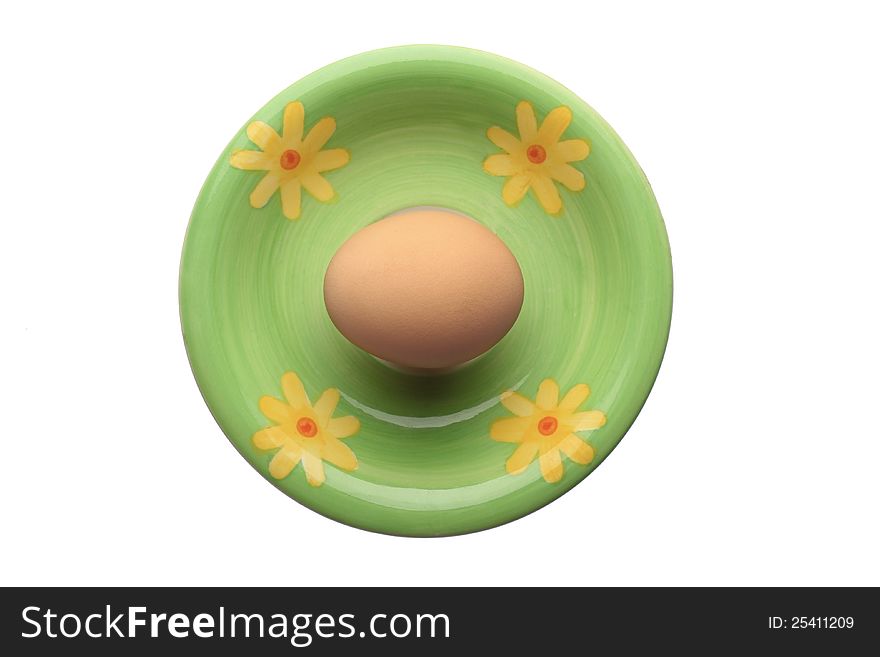 Egg on ceramic plate isolated on white. Egg on ceramic plate isolated on white