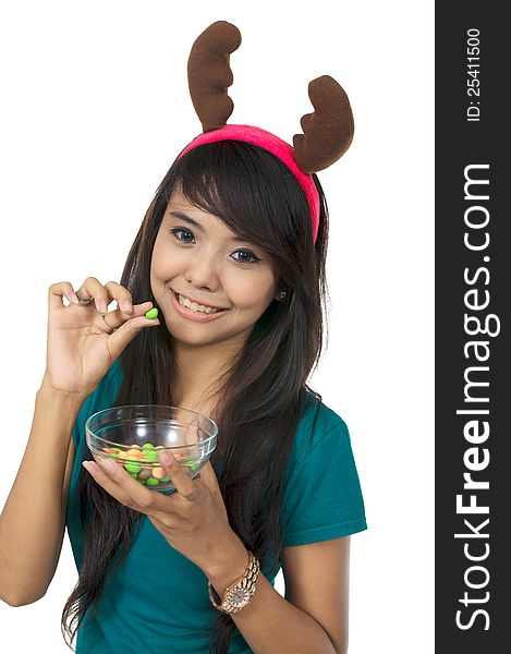 Santa woman eating candy isolated over white background