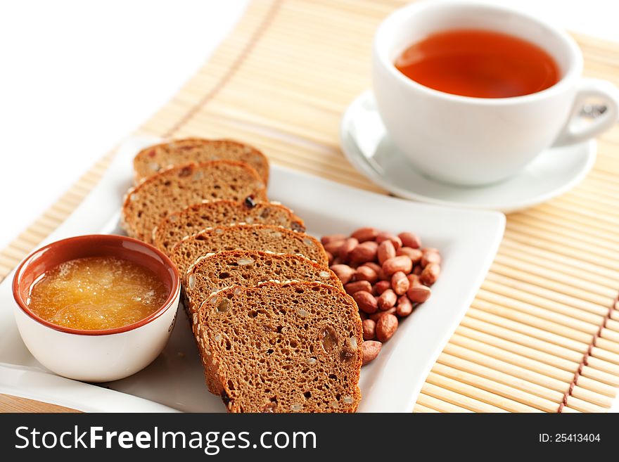 Tea with bread, flavored with honey and nuts