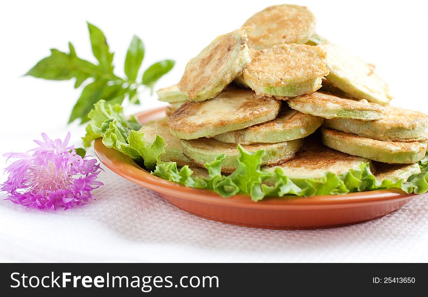 Fried zucchini on a brown dish