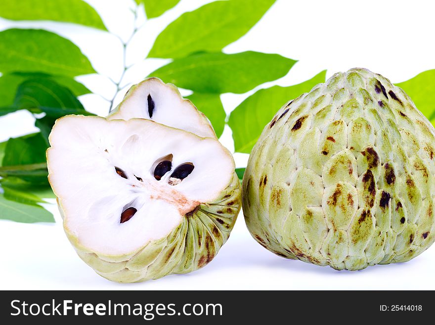 Fresh custard apple and leaf on white background