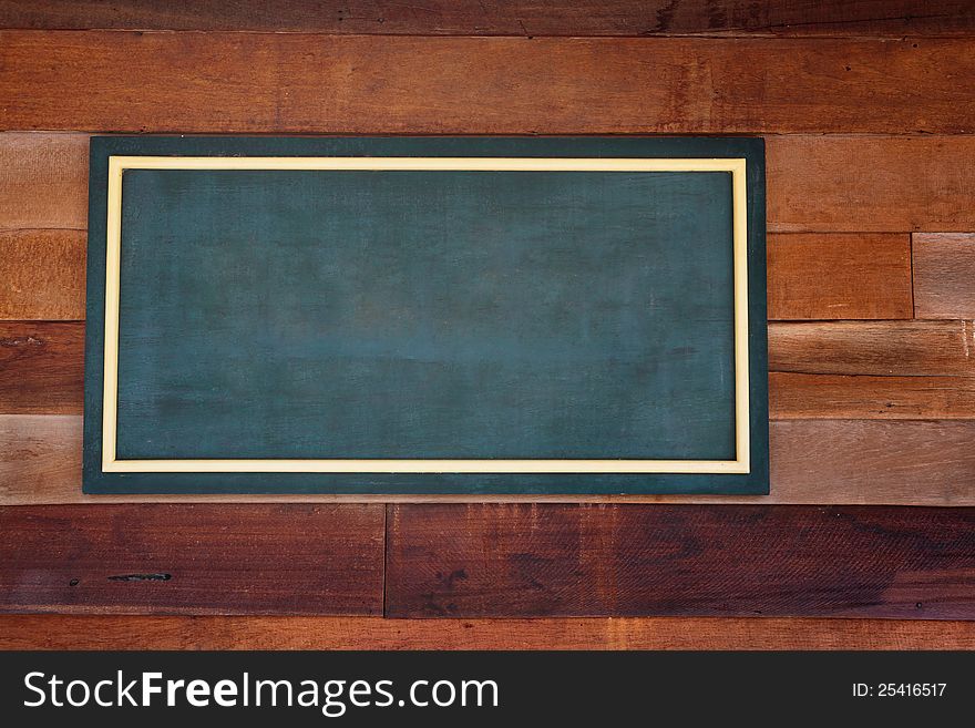 Closeup wooden background with chalkboard