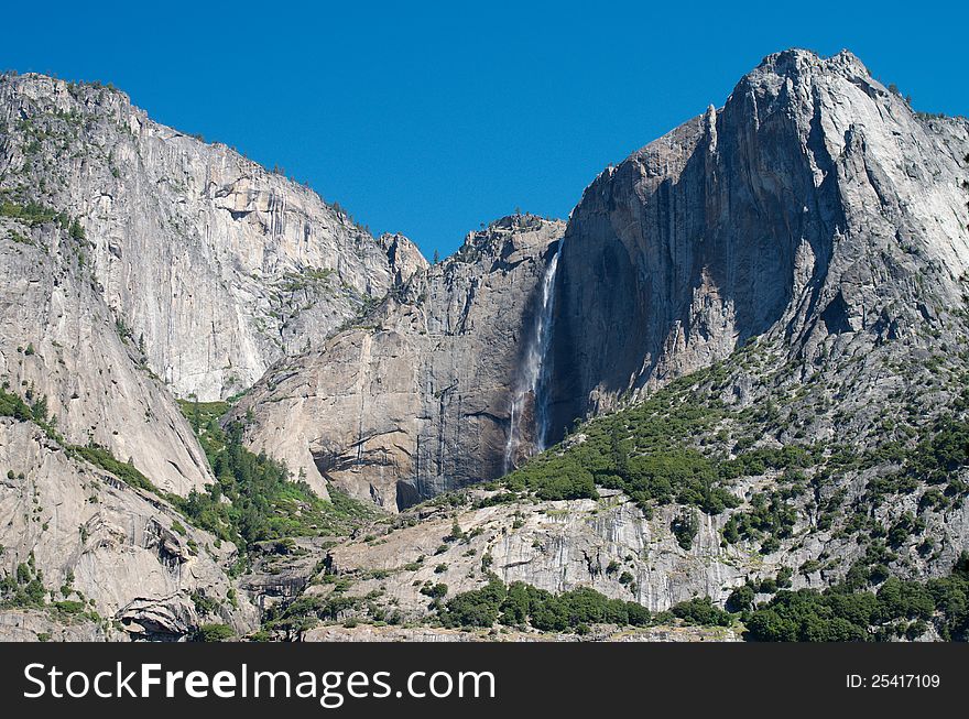 Magnific waterfall in green mountains, Yosemite national park, California, USA. Magnific waterfall in green mountains, Yosemite national park, California, USA