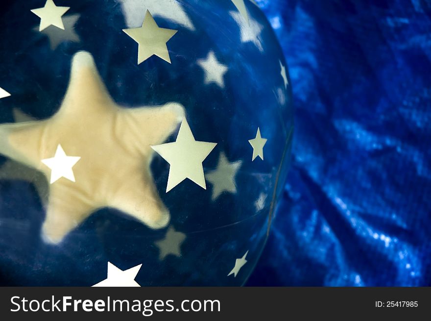 Yellow star in ball on blue background