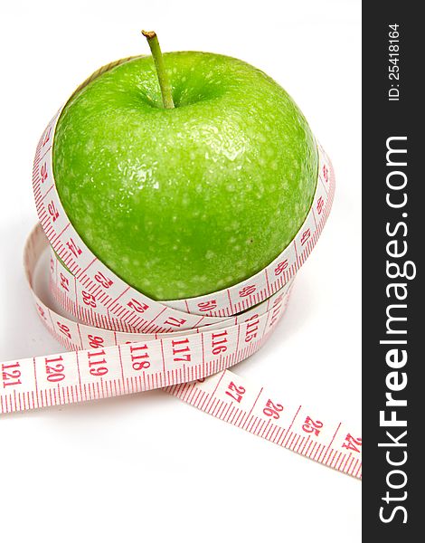 Green apple with measurement on white
