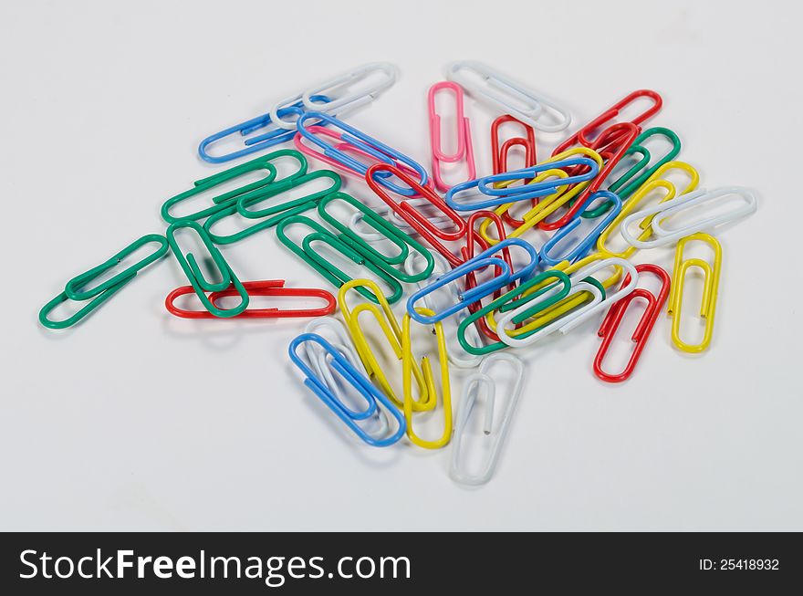 Colorful paper clip white background. Colorful paper clip white background