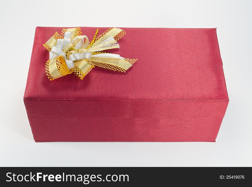 Red gift box with gold bow