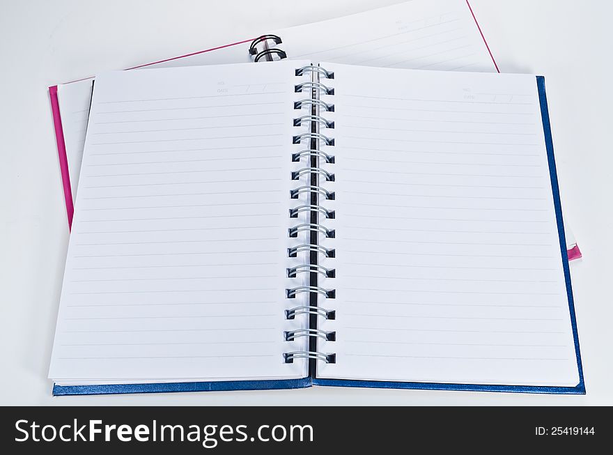 Open blank notebook on a white background ready for writing