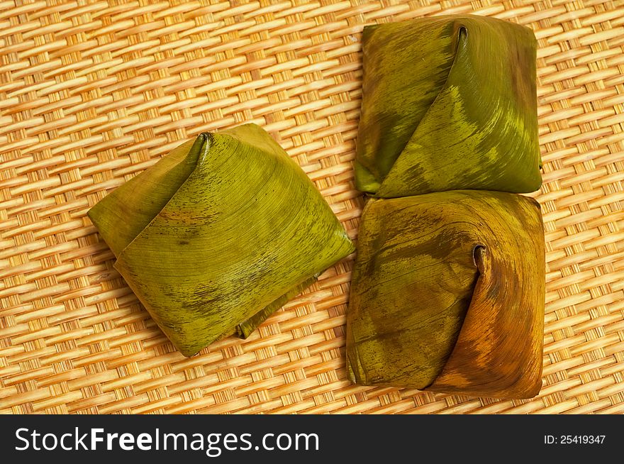 Thai desserts wrapped in banana leaf