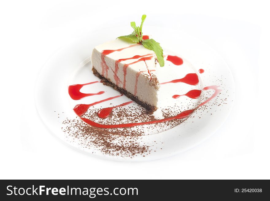 Cheesecake with jam on a white background