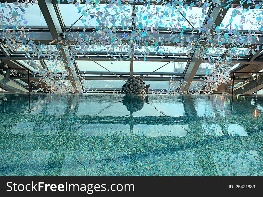 Swimming pool on a roof of a high-rise building overlooking the city. Swimming pool on a roof of a high-rise building overlooking the city