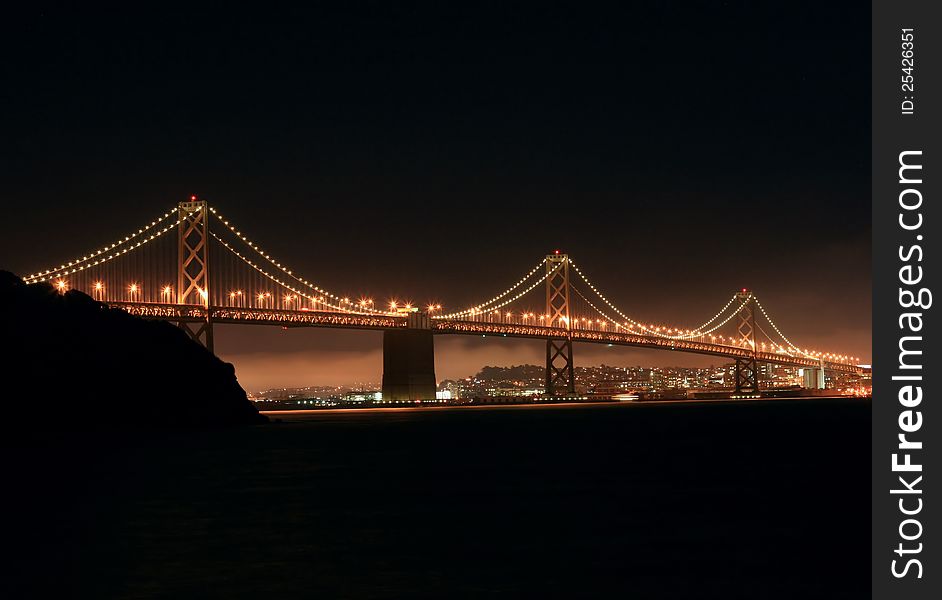 View of the Oakland-San Francisco Bay bridge at night from Treasure island