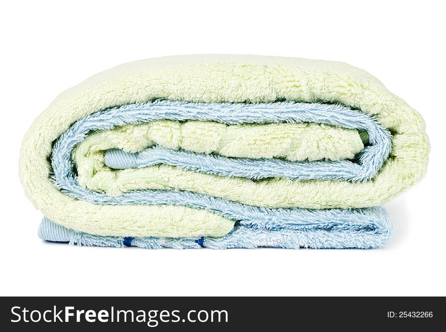 Blue towel is wrapped in green on a white background