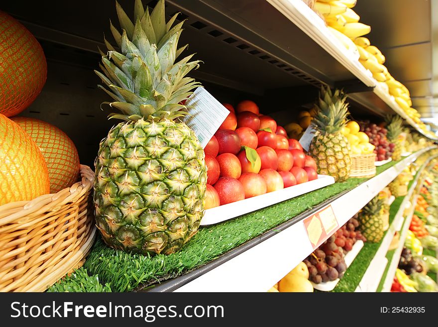 Pineapple and Fresh Fruits and Vegetables at the Grocery Market.