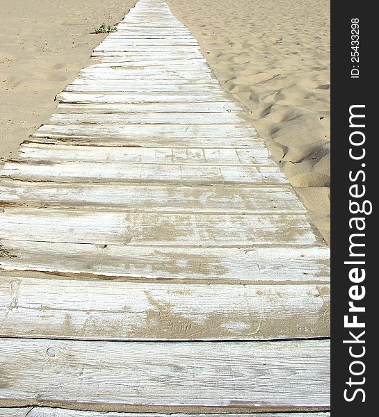 Plank deck path in sand beach. Plank deck path in sand beach