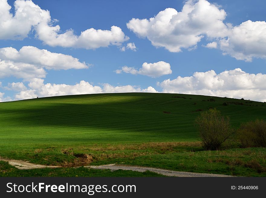 Shadows meadow sky clouds green. Shadows meadow sky clouds green