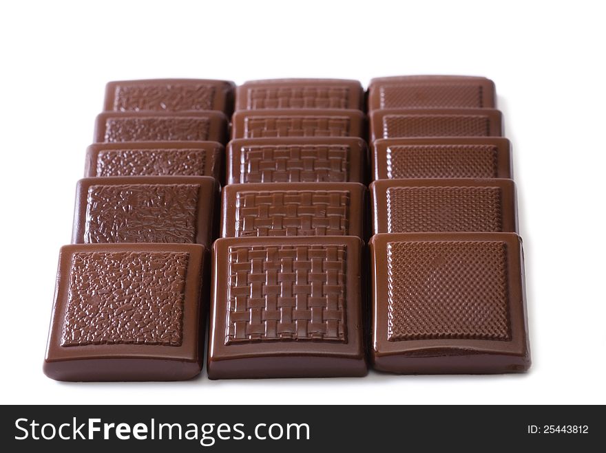 Chocolate tiles on a white background