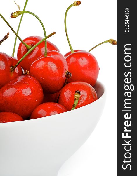 Fresh Ripe Cherry in white bowl cut out on white background