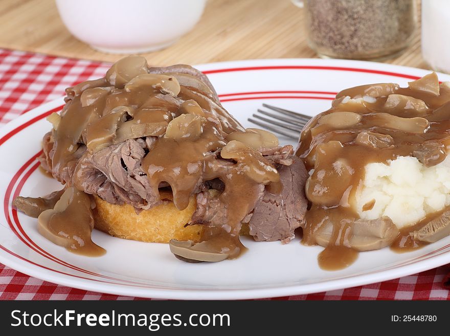Roast beef and mashed potatoes with mushroom gravy. Roast beef and mashed potatoes with mushroom gravy