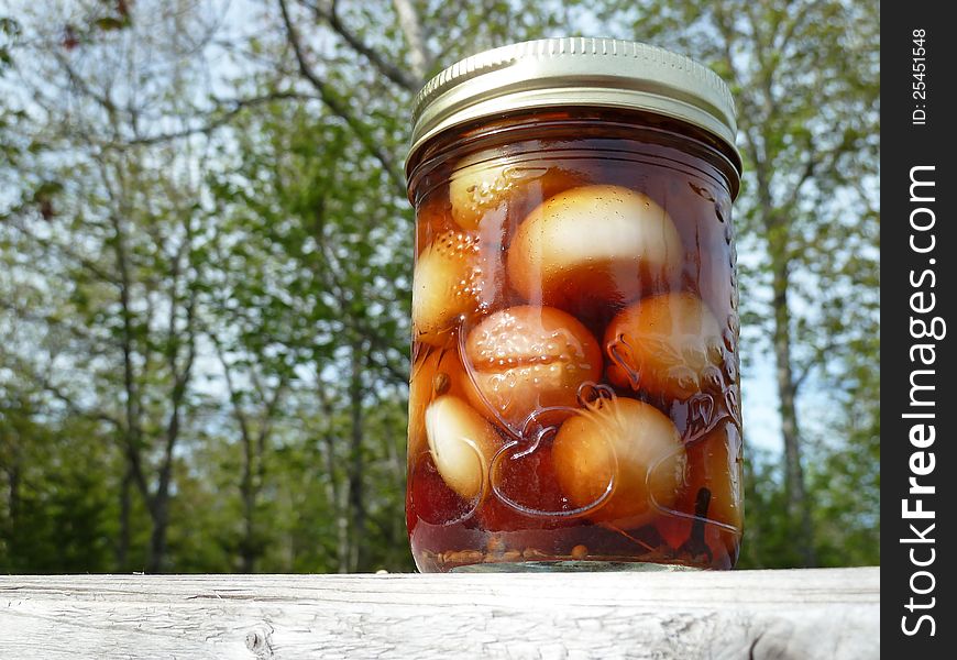 Jar of pickled onions with malt vinegar. Jar of pickled onions with malt vinegar