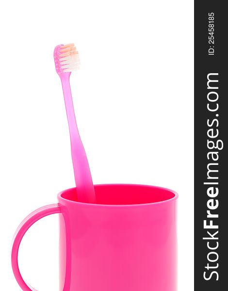 Toothbrush and cup on white background. Toothbrush and cup on white background