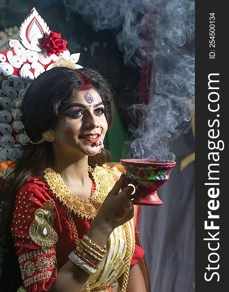 Concept Agomoni shoot.perfect makeup and wearing jewelers with traditional dress   like goddess,