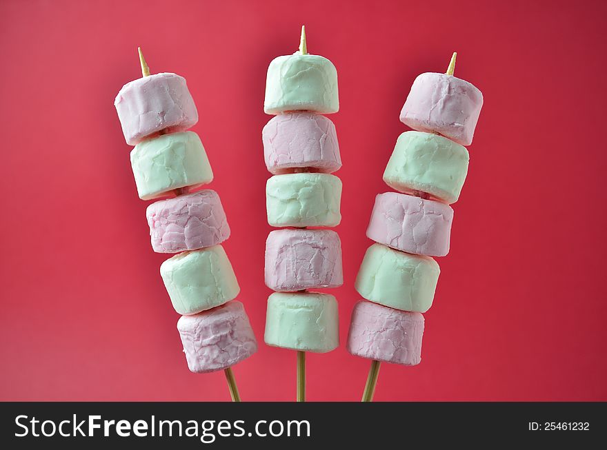 Pink and white marshmallows on skewers