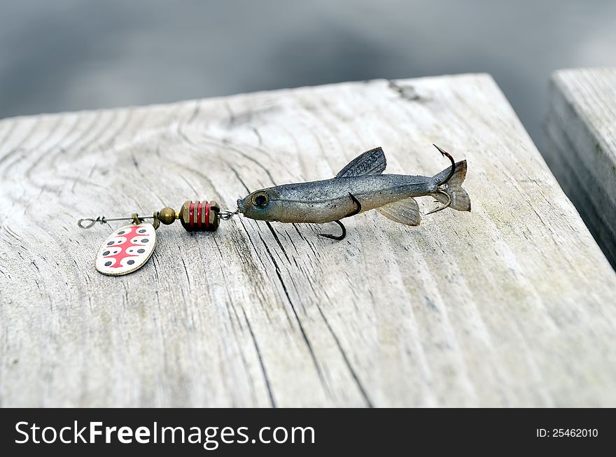 Fishing lure -floating wobbler  on a bridge