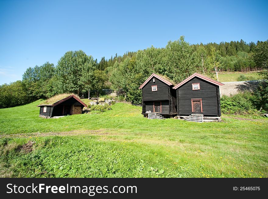 Norwegian landcape with traditional wooden huts. Norwegian landcape with traditional wooden huts