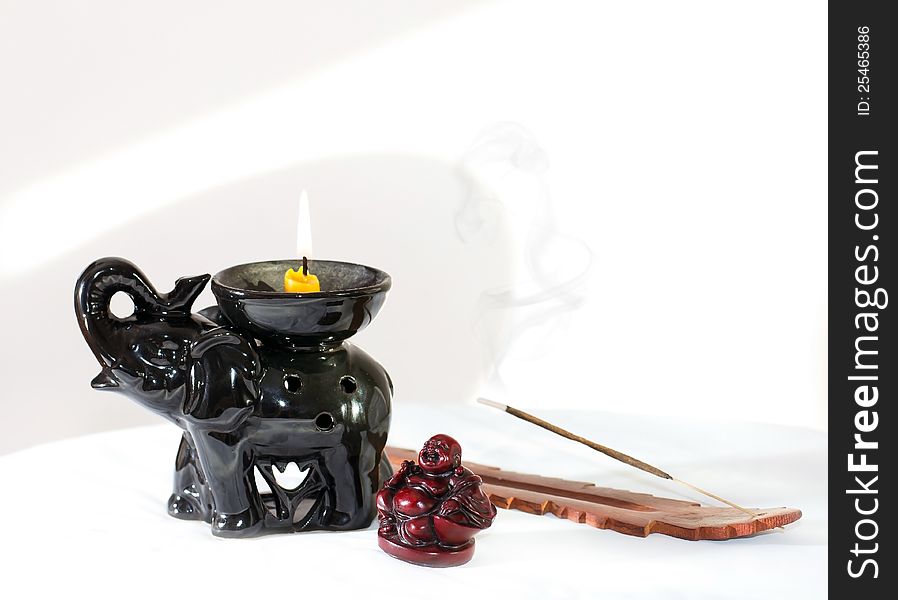 Statue of an elephant's trunk has lifted the candle, laughing buddha and fragrances stick, ÑÑ‚Ð°Ñ‚ÑƒÑÑ‚ÐºÐ° ÑÐ»Ð¾Ð½Ð° Ð¿Ð¾Ð´Ð½ÑÐ²ÑˆÐµÐ³Ð¾ Ñ…Ð¾Ð±Ð¾Ñ‚ ÑÐ¾ ÑÐ²ÐµÑ‡Ð¾Ð¹, ÑÐ¼ÐµÑŽÑ‰ÐµÐ³Ð¾ÑÑ  Ð±ÑƒÐ´Ð´Ñ‹ Ð¸ Ð°Ñ€Ð¾Ð¼Ð°Ð¿Ð°Ð»Ð¾Ñ‡ÐºÐ°. Statue of an elephant's trunk has lifted the candle, laughing buddha and fragrances stick, ÑÑ‚Ð°Ñ‚ÑƒÑÑ‚ÐºÐ° ÑÐ»Ð¾Ð½Ð° Ð¿Ð¾Ð´Ð½ÑÐ²ÑˆÐµÐ³Ð¾ Ñ…Ð¾Ð±Ð¾Ñ‚ ÑÐ¾ ÑÐ²ÐµÑ‡Ð¾Ð¹, ÑÐ¼ÐµÑŽÑ‰ÐµÐ³Ð¾ÑÑ  Ð±ÑƒÐ´Ð´Ñ‹ Ð¸ Ð°Ñ€Ð¾Ð¼Ð°Ð¿Ð°Ð»Ð¾Ñ‡ÐºÐ°