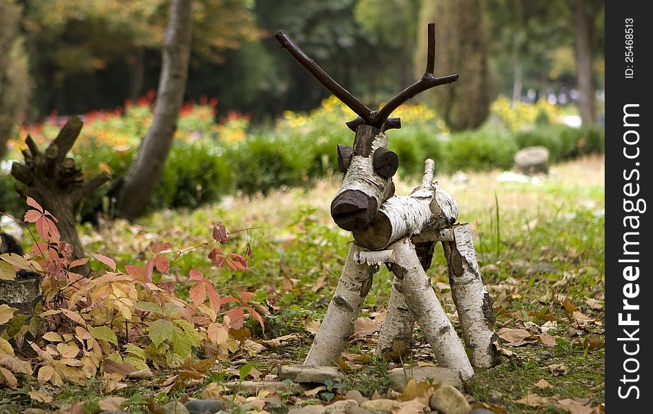 Folk arts - a figure of a wooden deer in the meadow