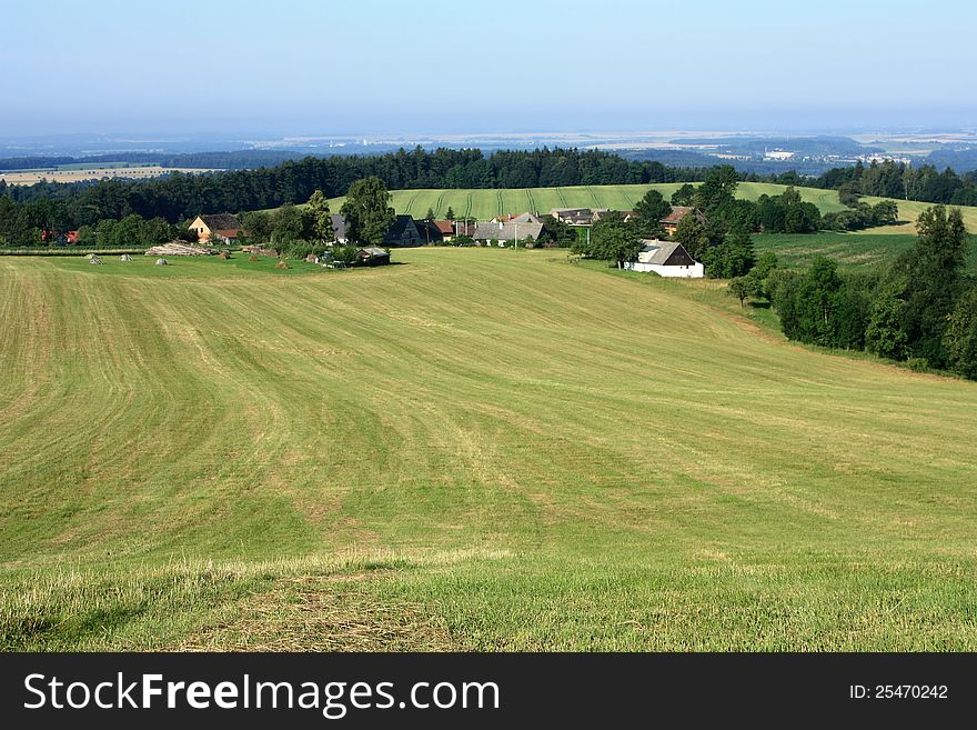 Summer landscape of the czech rural village, green fields, meadows and trees. Summer landscape of the czech rural village, green fields, meadows and trees