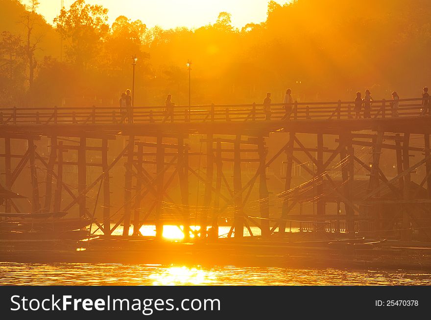 Mon Bridge and sunset, old construct in Thailand