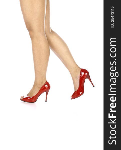 Woman wearing red shoes isolated over white background
