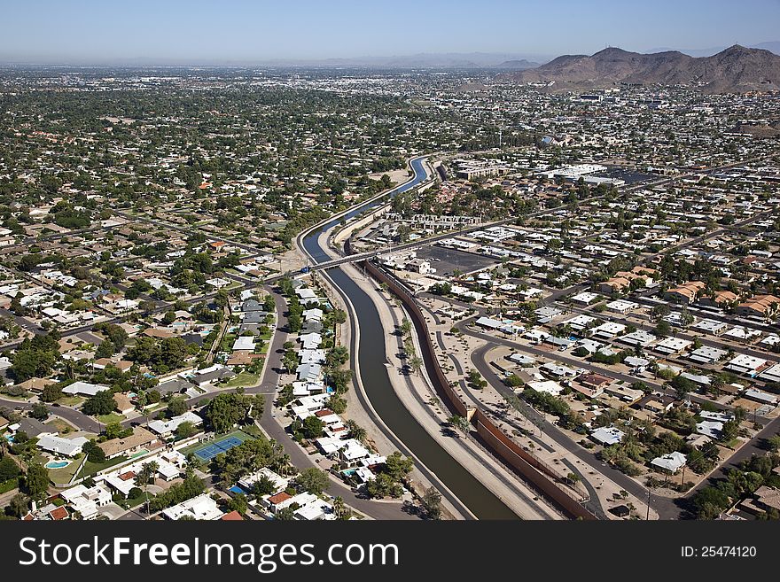 Aerial view of an irrigation canal running through the suburbs of Phoenix, Arizona