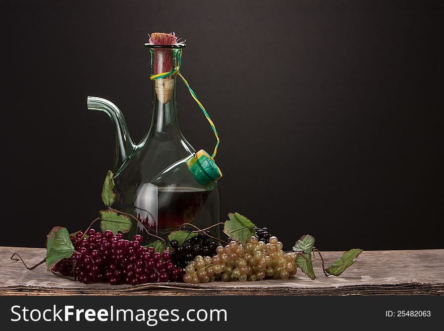 Wine glass bottle with grapes