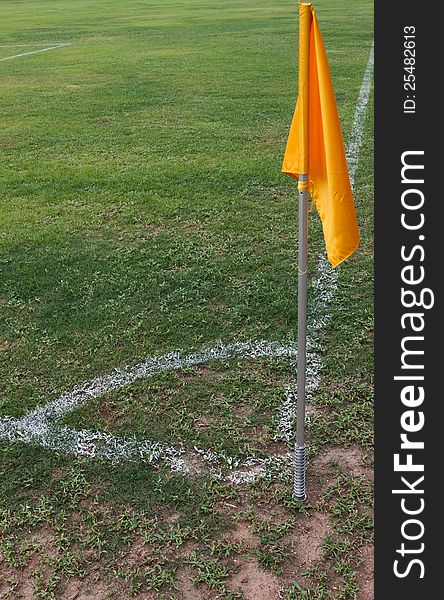 Soccer field with green grass background and yellow flag. Soccer field with green grass background and yellow flag