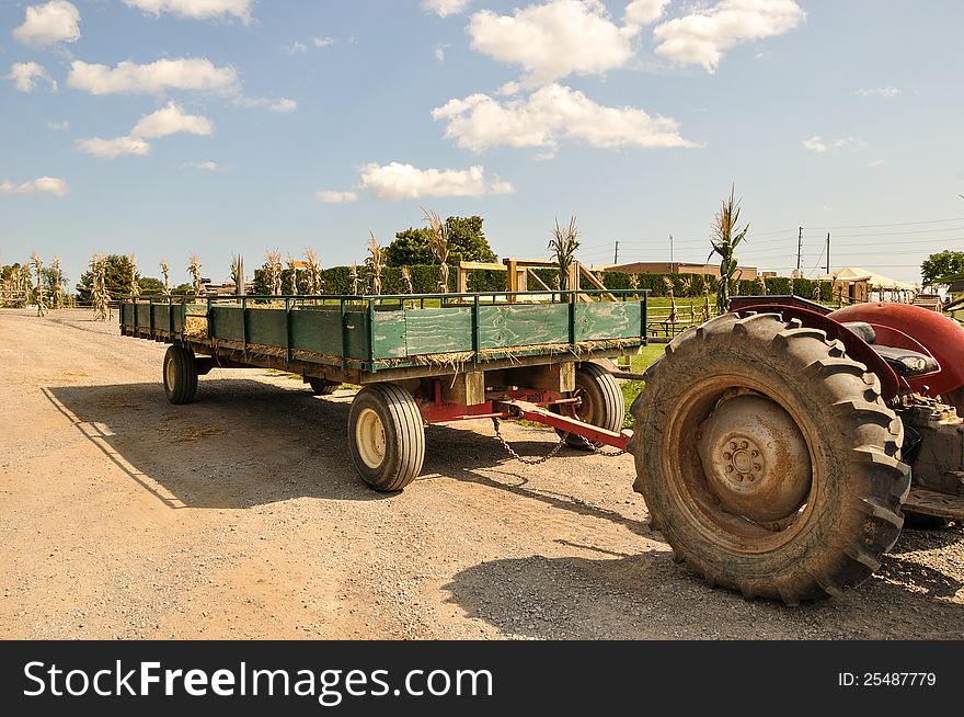 Farmyard scene with hay wagon and tractor