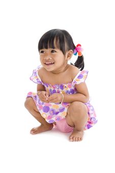 Cute Girl Crouching Royalty Free Stock Photography