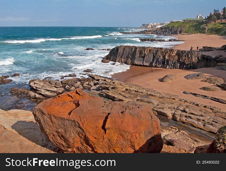 The coast line, including a secluded beach at Ballito, KwaZulu-Natal North Coast, South Africa, with holiday accommodation in the distance.